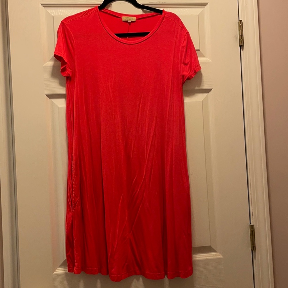 Women’s coral Piko dress with pockets